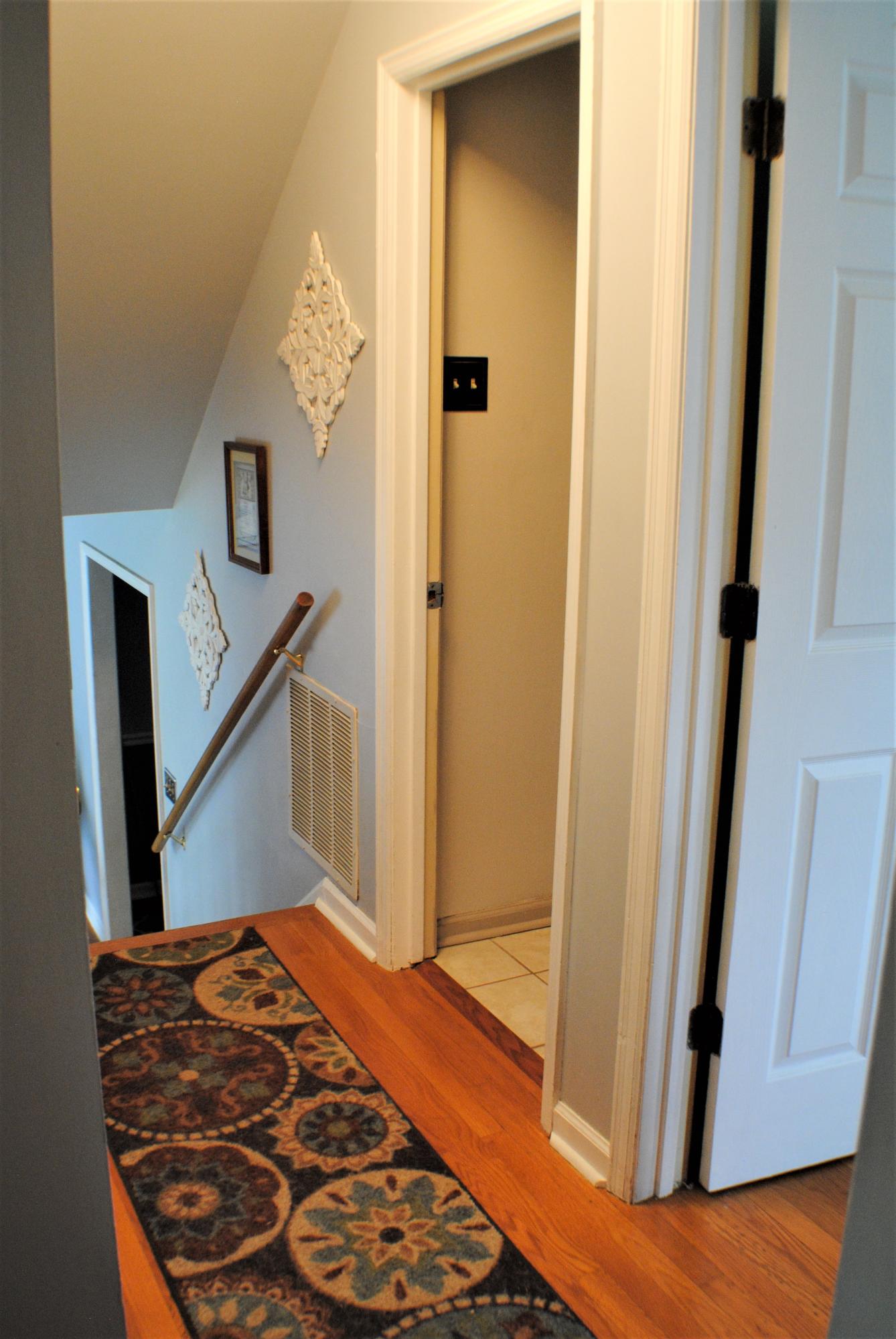 5229 Cave Spring Lane Roanoke, VA 24018 - Photo 37 of 49 a bedroom with a bed and wooden floor