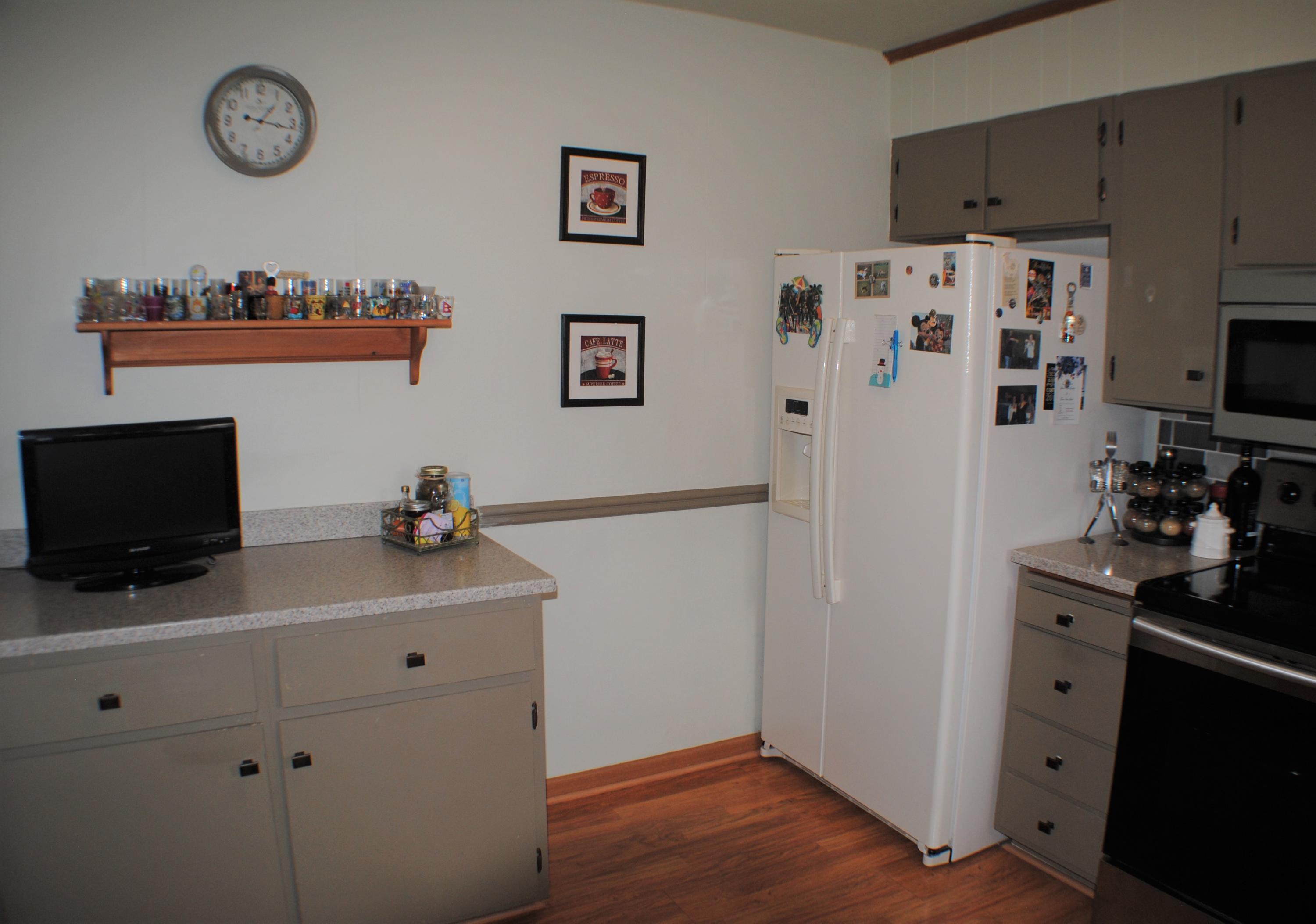 5229 Cave Spring Lane Roanoke, VA 24018 - Photo 9 of 49 a view of a kitchen with refrigerator and wooden floor