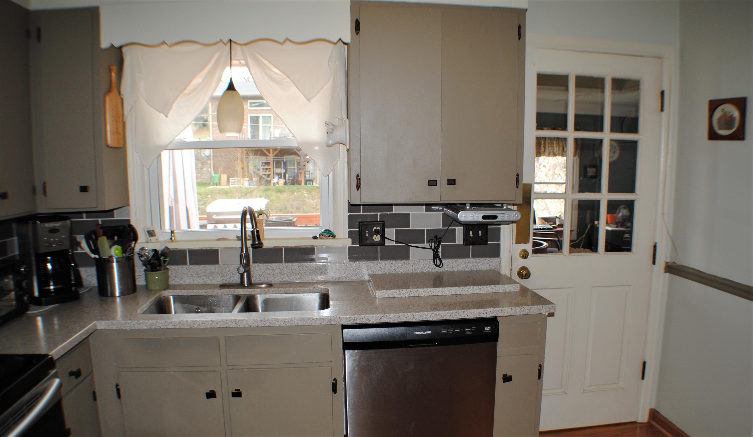 5229 Cave Spring Lane Roanoke, VA 24018 - Photo 10 of 49 a view of living room with granite countertop furniture and a fireplace