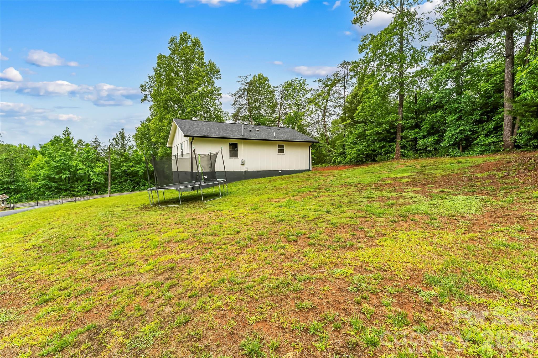 825 South Creek Road Nebo, NC 28761 - Photo 27 of 34 a view of a house with a yard