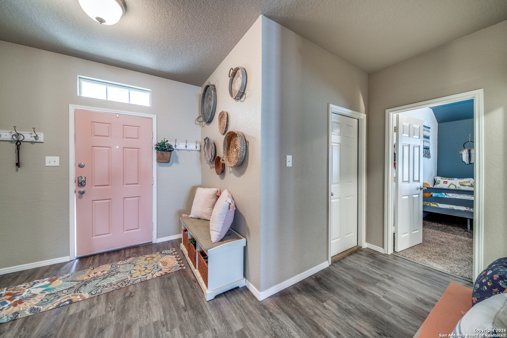 7211 Marina Del Rey Converse, TX 78109 - Photo 5 of 25 a view of a room that has a bed and wooden floor