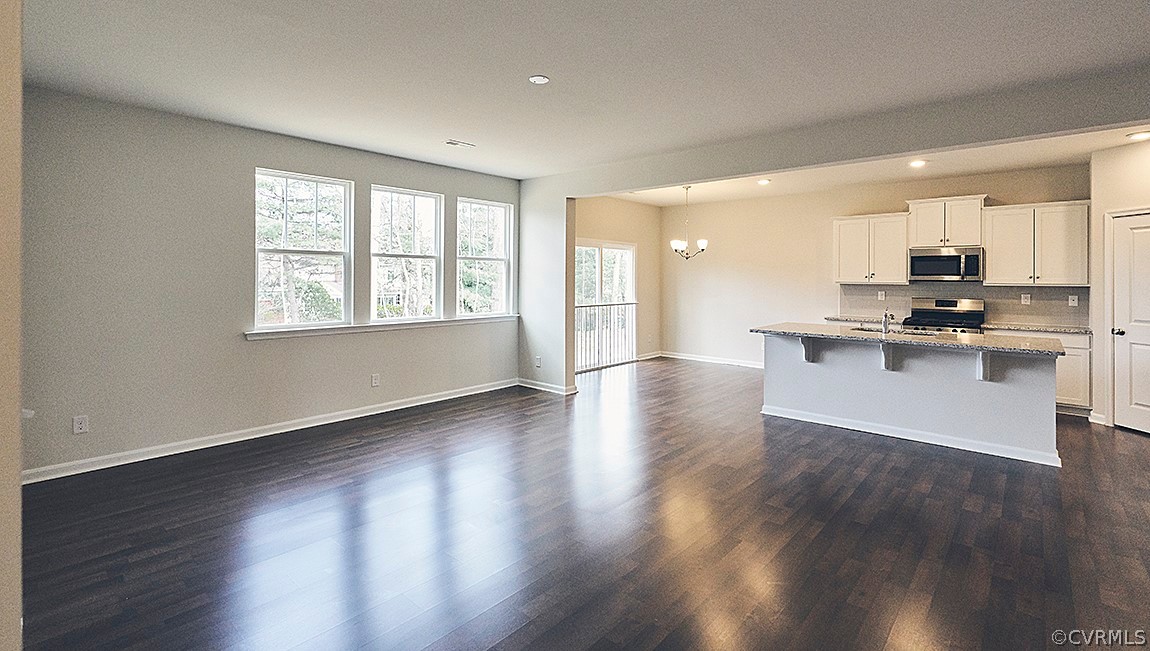 1400 Braisden Road Midlothian, VA 23114 - Photo 4 of 18 a view of a kitchen with a sink wooden floor and a window