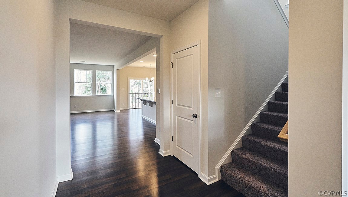 1400 Braisden Road Midlothian, VA 23114 - Photo 5 of 18 a view of a hallway with wooden floor and stairs