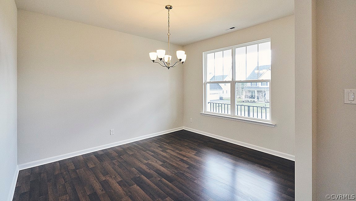 1400 Braisden Road Midlothian, VA 23114 - Photo 6 of 18 a view of an empty room with wooden floor and a window
