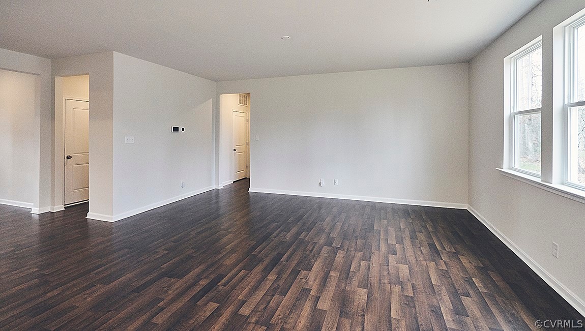 1400 Braisden Road Midlothian, VA 23114 - Photo 7 of 18 a view of an empty room with wooden floor and a window