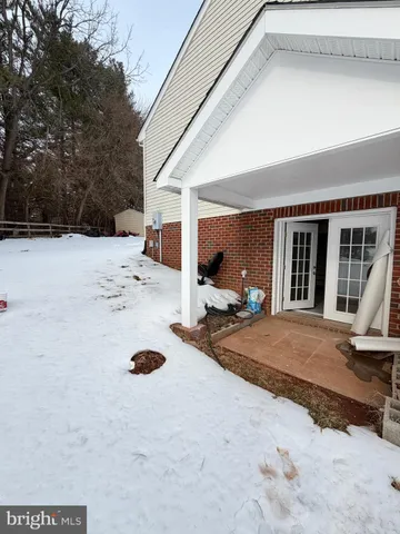 a view of a chair and tables in the house