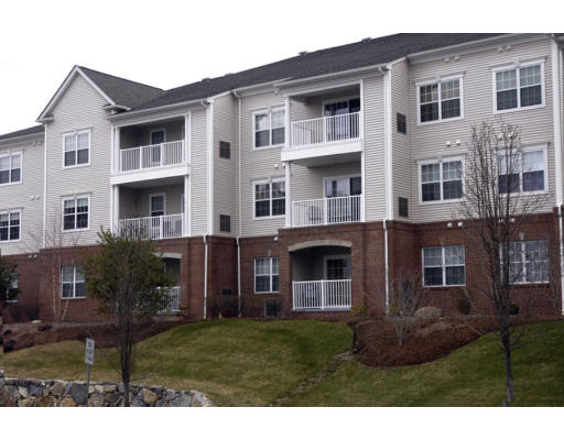170 Haverhill Street, Unit 138 Andover, MA 01810 - Photo 1 of 16 a front view of a house with a yard