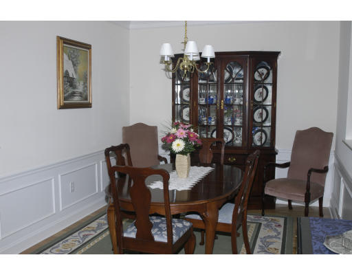 170 Haverhill Street, Unit 138 Andover, MA 01810 - Photo 5 of 16 a view of a dining room with furniture and chandelier
