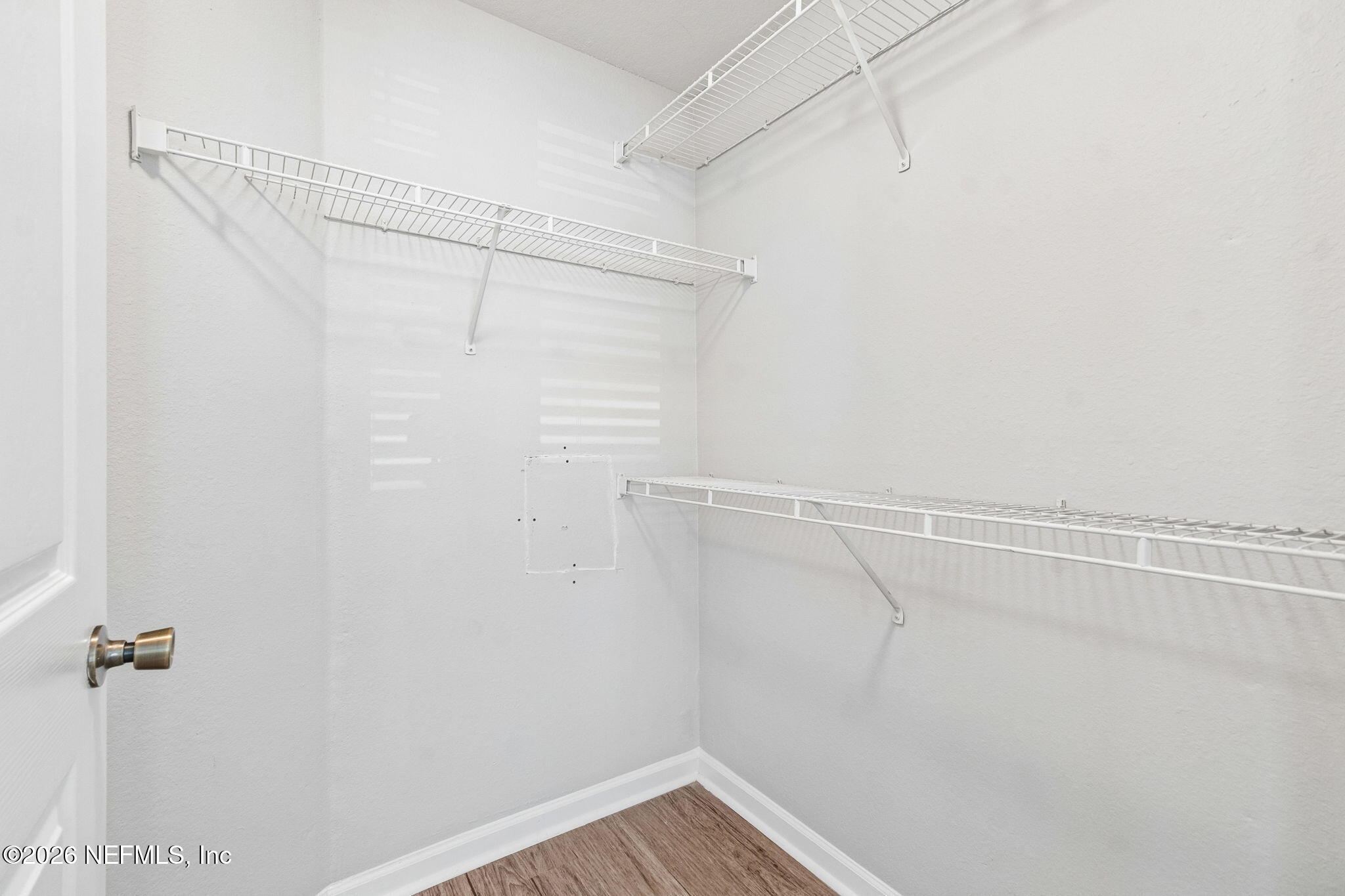 8550 Touchton Road, Unit 511 Jacksonville, FL 32216 - Photo 31 of 63 a view of a room with racks on the wall