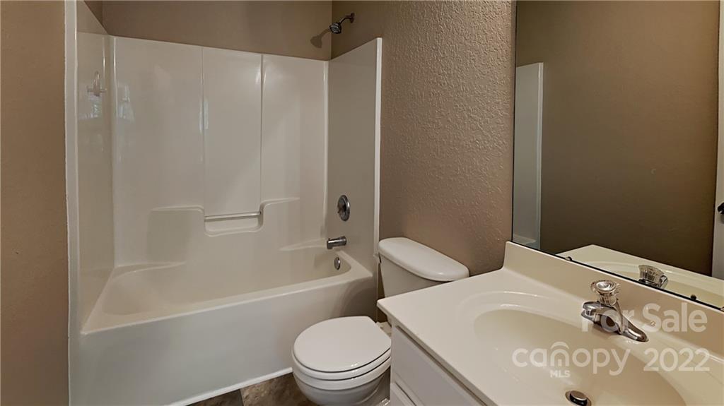 701 Raindrops Road Gastonia, NC 28054 - Photo 3 of 14 a white toilet sitting next to a bath tub