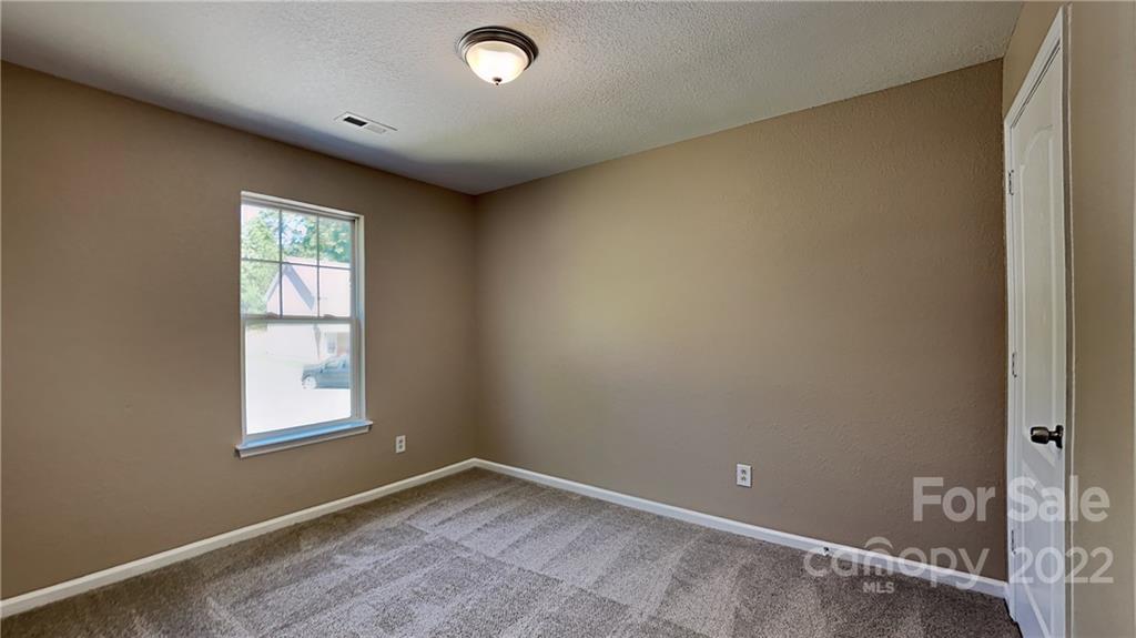 701 Raindrops Road Gastonia, NC 28054 - Photo 4 of 14 an empty room with windows