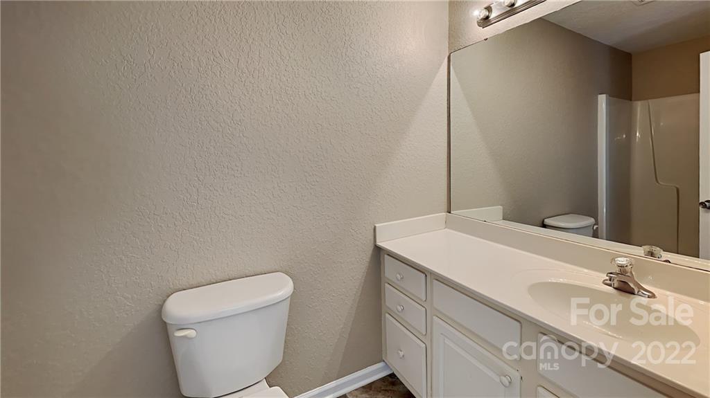 701 Raindrops Road Gastonia, NC 28054 - Photo 7 of 14 a bathroom with a sink and a toilet
