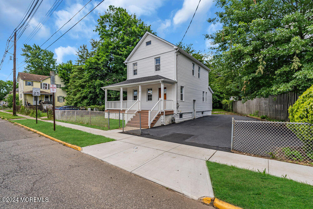 57 Jackson Street Freehold, NJ 07728 - Photo 20 of 48 a view of house with a yard and a large tree