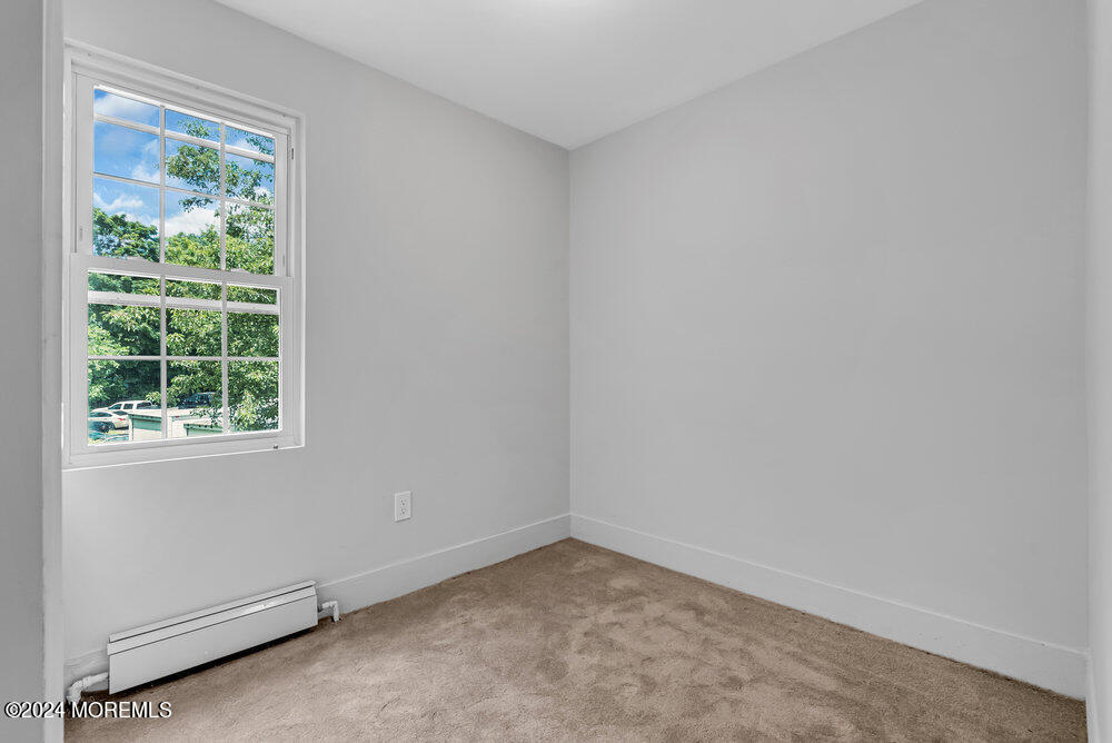57 Jackson Street Freehold, NJ 07728 - Photo 34 of 48 an empty room with a window