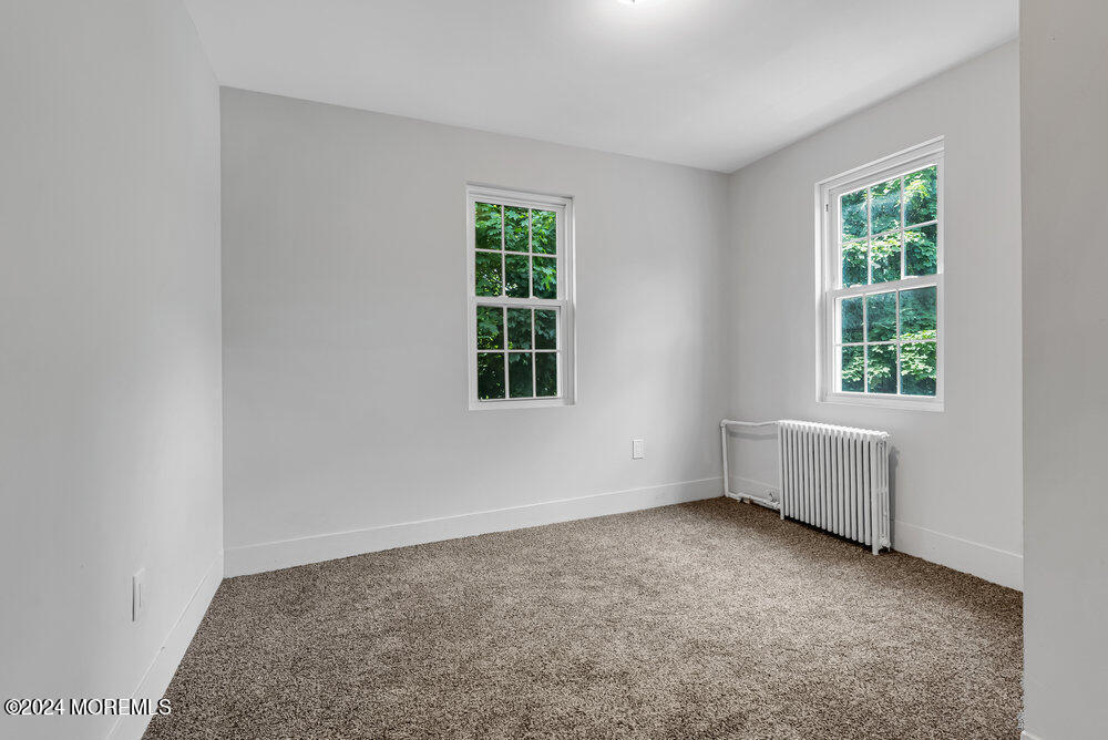 57 Jackson Street Freehold, NJ 07728 - Photo 36 of 48 an empty room with a window