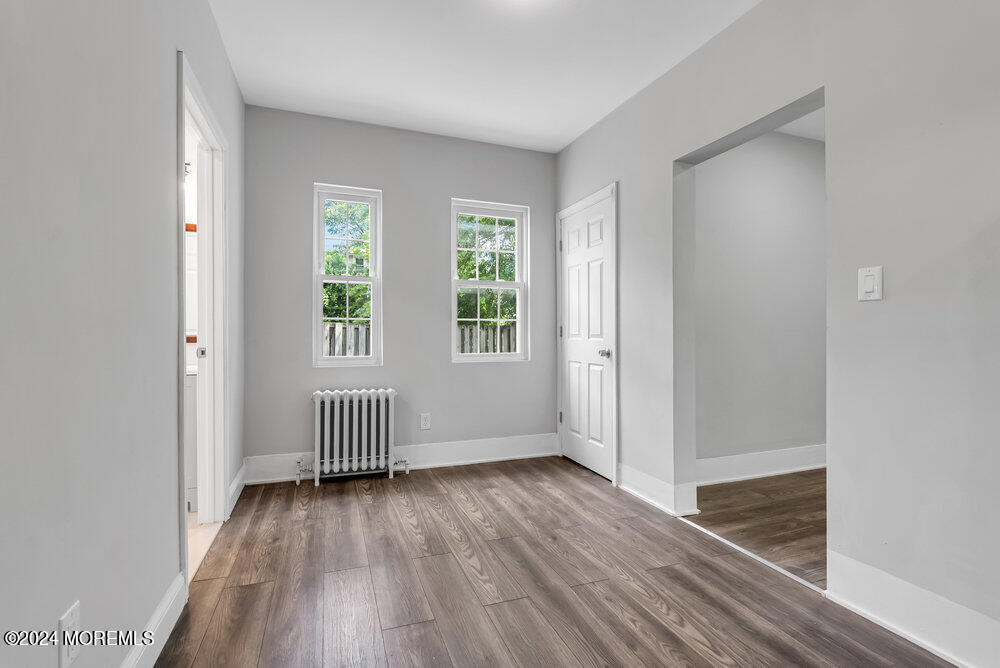 57 Jackson Street Freehold, NJ 07728 - Photo 44 of 48 an empty room with wooden floor and windows