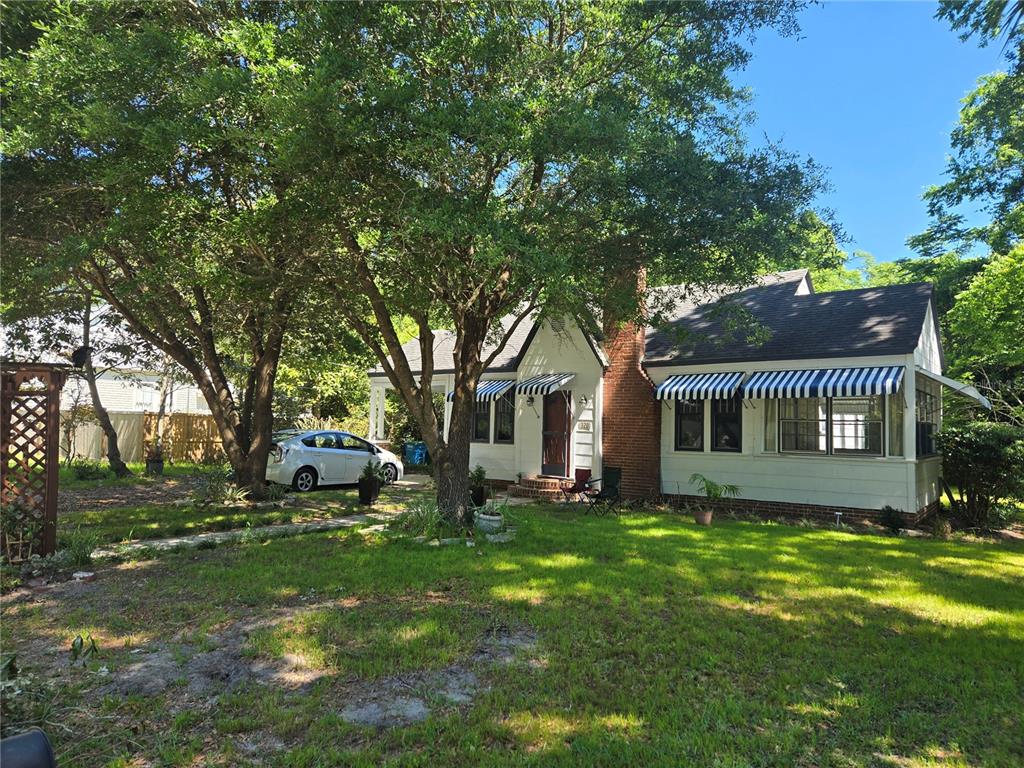 Undisclosed Address High Springs, FL 32643 - Photo 1 of 31 a front view of house with yard and trees