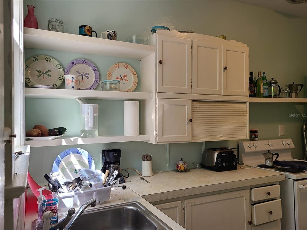 Undisclosed Address High Springs, FL 32643 - Photo 19 of 31 a kitchen with white cabinets and sink