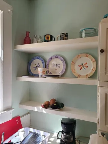 a cabinet with chair and wooden floor