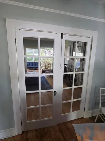 a living room with furniture a couch and large window
