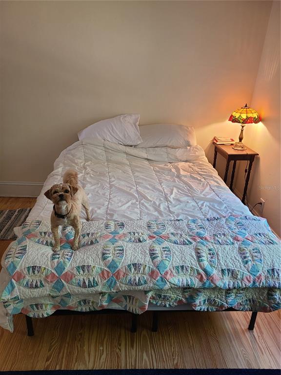 Undisclosed Address High Springs, FL 32643 - Photo 31 of 31 a bedroom with a bed and wooden floor