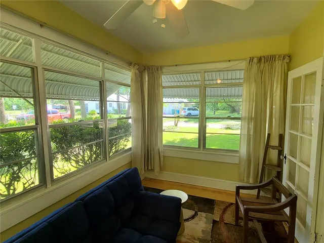 a living room with furniture and a window
