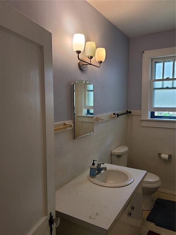 Undisclosed Address High Springs, FL 32643 - Photo 8 of 31 a bathroom with a sink a toilet and mirror