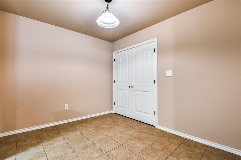 6452 Gregg Road Krum, TX 76249 - Photo 3 of 10 Empty room featuring baseboards and light tile patterned floors