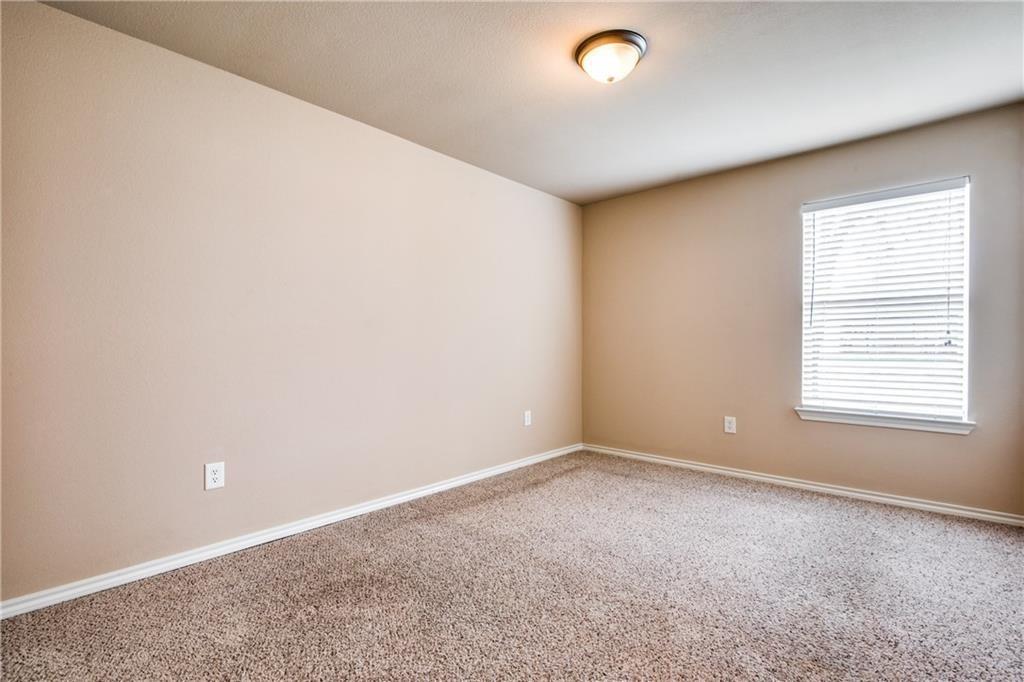 6452 Gregg Road Krum, TX 76249 - Photo 6 of 10 Carpeted empty room featuring baseboards