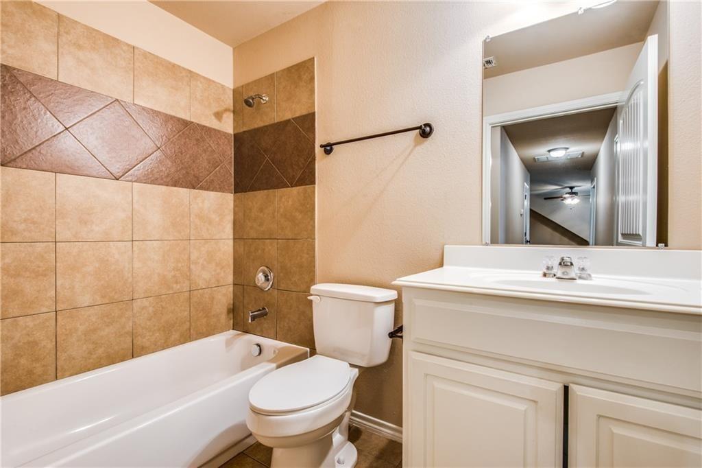 6452 Gregg Road Krum, TX 76249 - Photo 7 of 10 Full bathroom featuring vanity and shower / tub combination