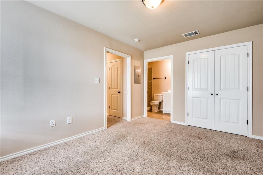 6452 Gregg Road Krum, TX 76249 - Photo 9 of 10 Unfurnished bedroom featuring light colored carpet, ensuite bath, and a closet