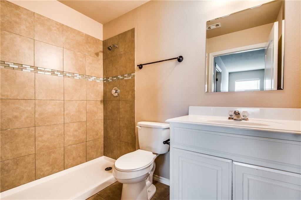 6452 Gregg Road Krum, TX 76249 - Photo 10 of 10 Bathroom featuring vanity and a shower stall