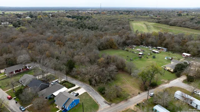an aerial view of a house with a lake view