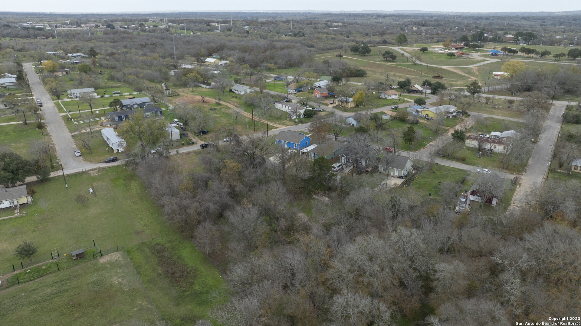305 Trinity Street Luling, TX 78648 - Photo 14 of 25 an aerial view of residential houses with outdoor space and trees