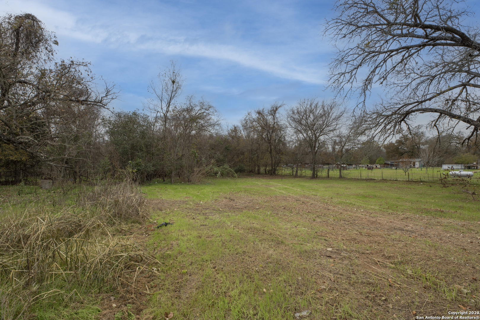305 Trinity Street Luling, TX 78648 - Photo 17 of 25 a view of a field with trees