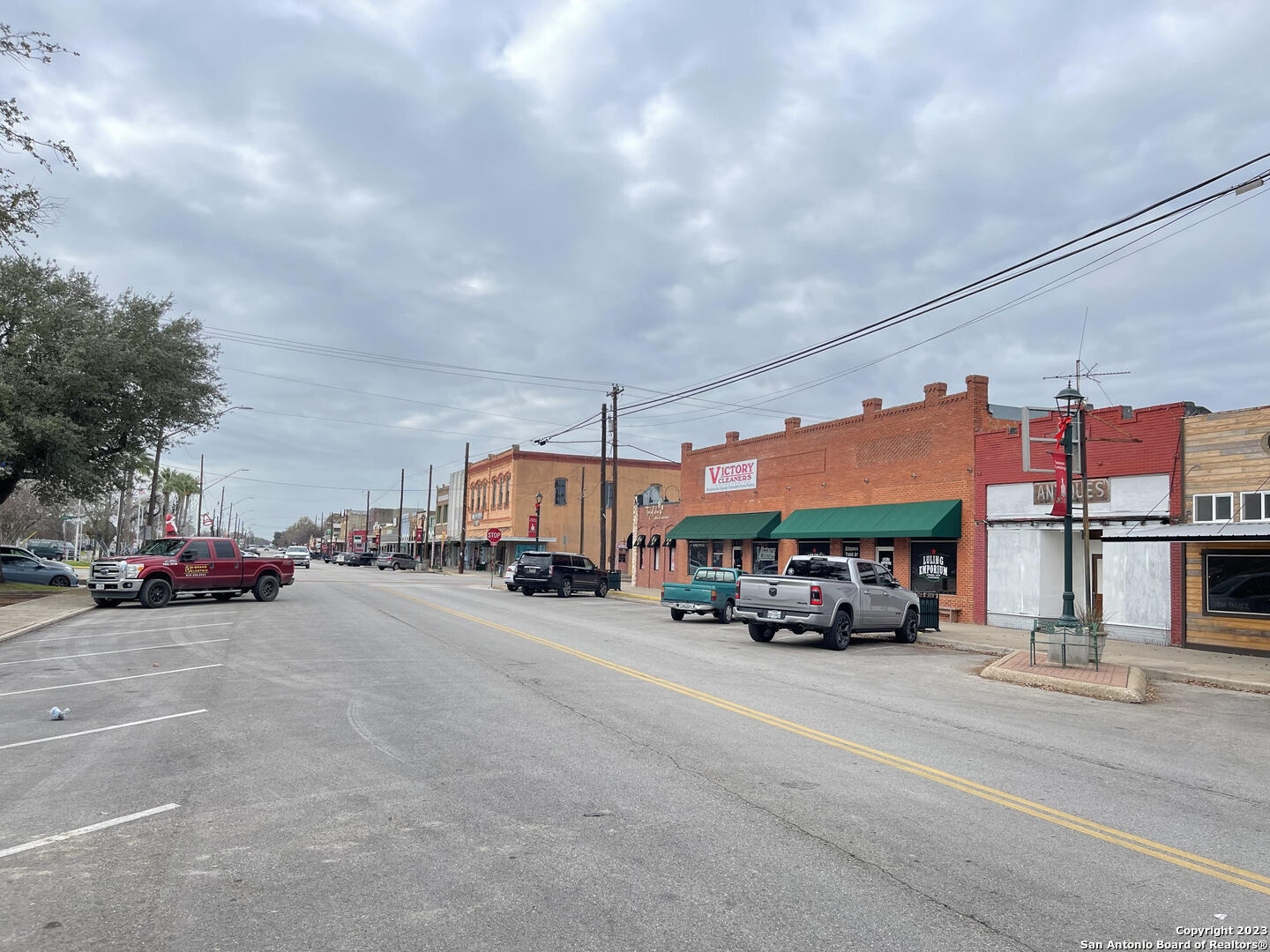 305 Trinity Street Luling, TX 78648 - Photo 20 of 25 a car parked in front of a building