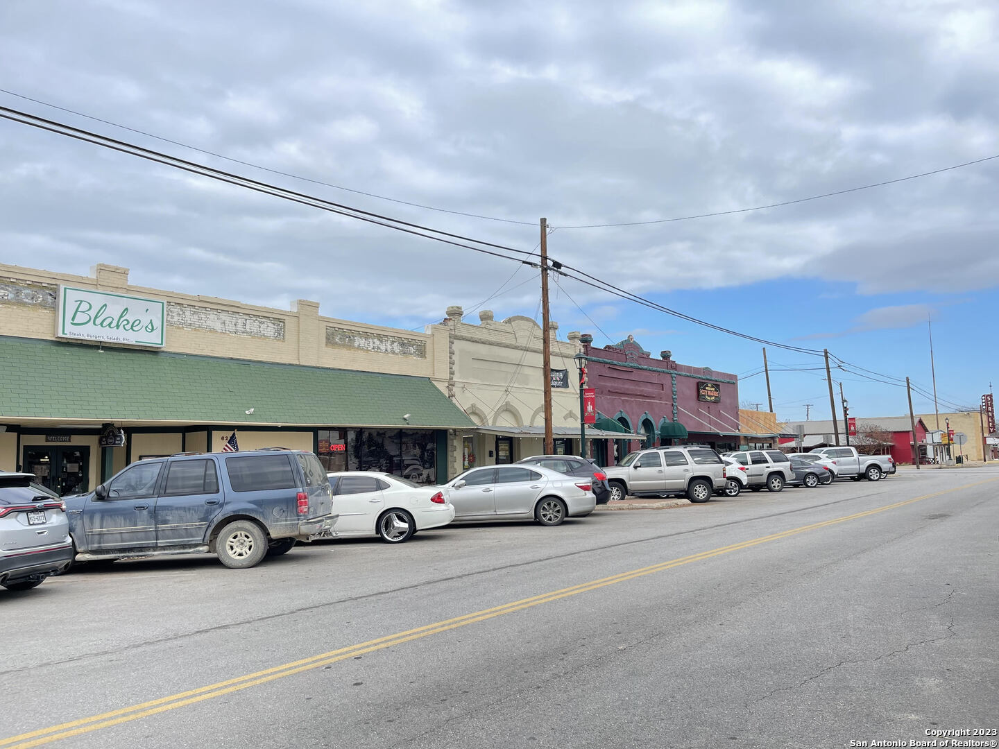 305 Trinity Street Luling, TX 78648 - Photo 21 of 25 a car parked in front of a building