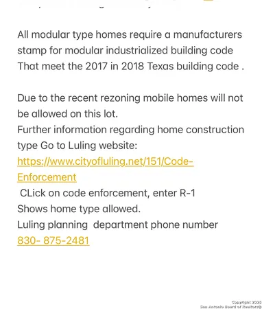 a aerial view of a house with a yard