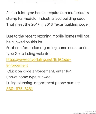 a aerial view of a house with a yard