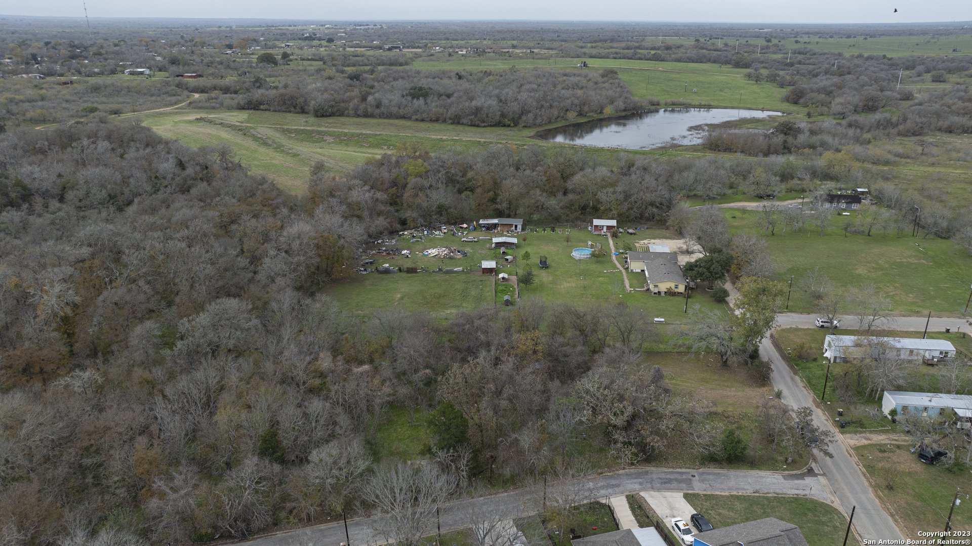 305 Trinity Street Luling, TX 78648 - Photo 4 of 25 a view of a town with river and trees