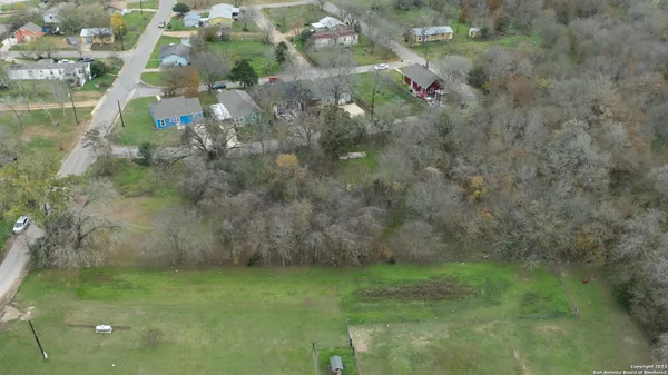 a view of a field with trees