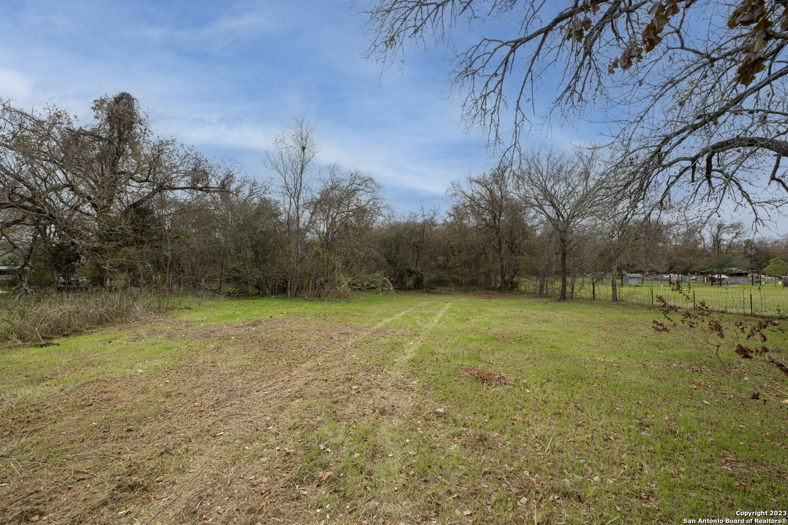 305 Trinity Street Luling, TX 78648 - Photo 8 of 25 a view of a field with trees