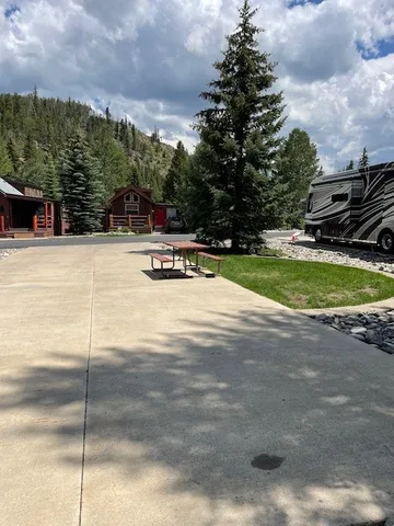 a view of a park with swings and slides