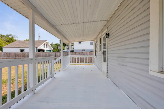 a view of a house with pool and sitting area