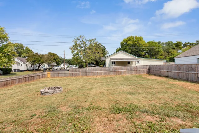 a view of a house with pool and sitting area