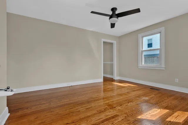 a view of a dining room with furniture and window