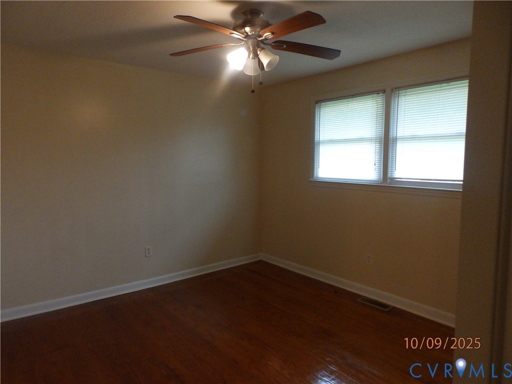 860 Lebanon Road Spring Grove, VA 23881 - Photo 23 of 32 an empty room with a window and a fan