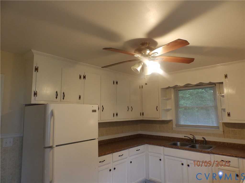 860 Lebanon Road Spring Grove, VA 23881 - Photo 26 of 32 a kitchen with a refrigerator a sink and cabinets