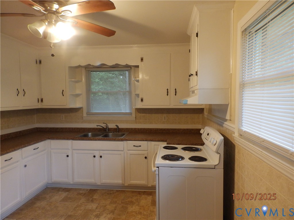 860 Lebanon Road Spring Grove, VA 23881 - Photo 27 of 32 a kitchen with a sink a stove and cabinets