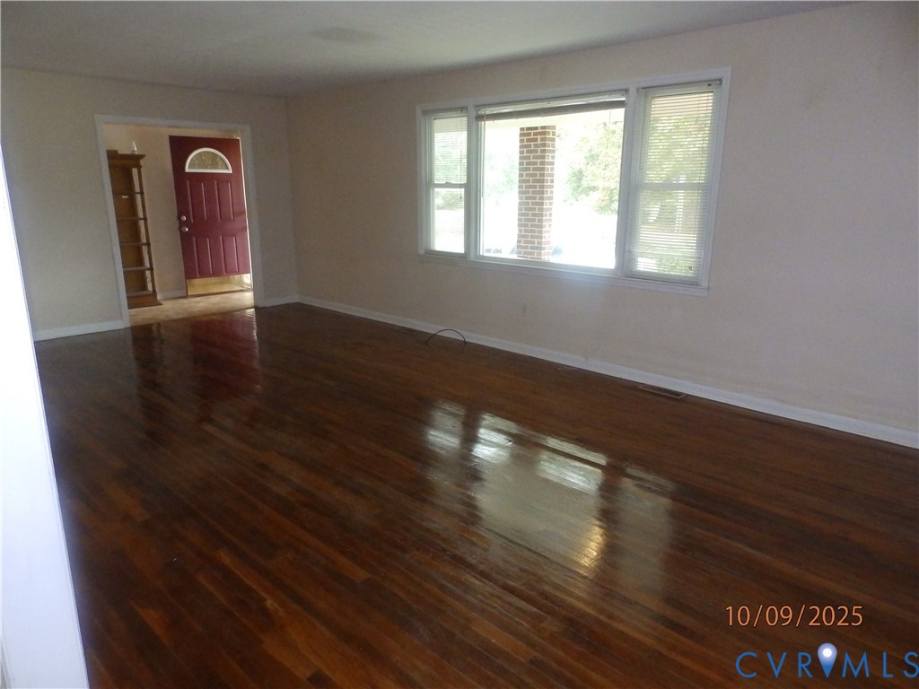860 Lebanon Road Spring Grove, VA 23881 - Photo 8 of 32 a view of empty room with wooden floor and fan